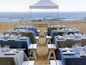 Natural wood benches at the beach wedding