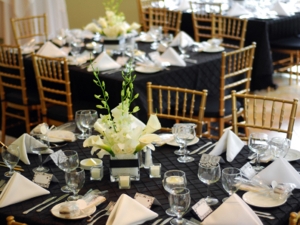 Gold Chiavari chairs at event tables