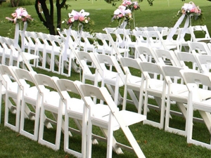 White resin folding chairs are lined up