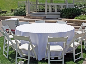 Resin folding chairs at round table setup