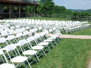 White plastic folding chairs setup