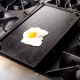 Reversible stove top griddle with amlet